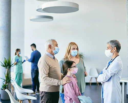 family communicating with family doctor