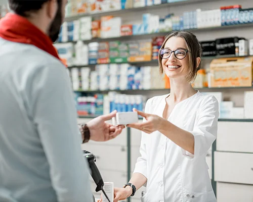 pharmacist selling medications to customer